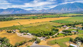 Aerial view of sparsely populated area with a mountain backdrop