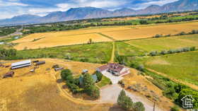 Aerial view of sparsely populated area with a mountainous background