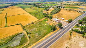 Aerial view of sparsely populated area featuring extensive farmland