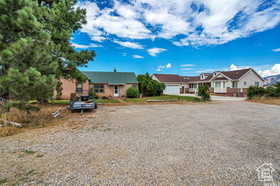 Ranch-style home featuring driveway and a residential view