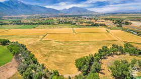 Aerial view of sparsely populated area with a mountainous background