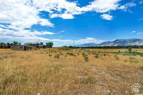 View of mountain background featuring rural landscape