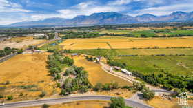 Overview of rural landscape featuring a mountainous background