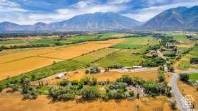 Aerial view of sparsely populated area with a mountain backdrop