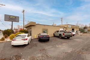 View of property with uncovered parking