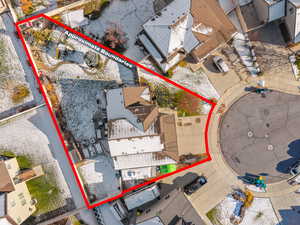 Aerial perspective of suburban area featuring property parcel outlined
