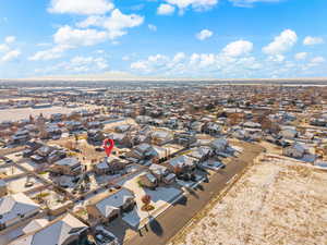 Aerial overview of property's location featuring nearby suburban area