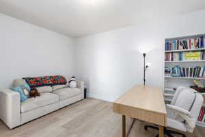 Office area with wood finished floors and baseboards