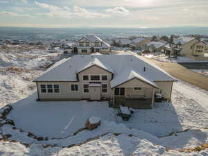 Snowy aerial view with a residential view