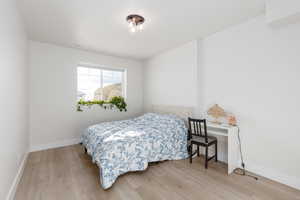 Bedroom featuring light wood-style floors