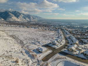 Snowy aerial view with a residential view and a mountain view