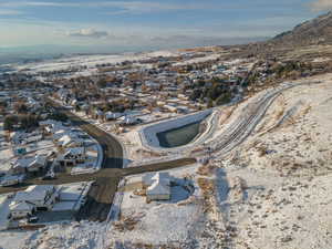Snowy aerial view with a residential view and a mountain view