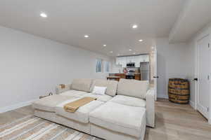 Living area featuring recessed lighting and light wood finished floors
