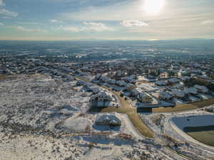 Snowy aerial view with a residential view