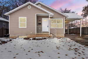 Bungalow-style home with an attached carport