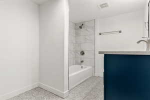 Full bath with bathing tub / shower combination and vanity