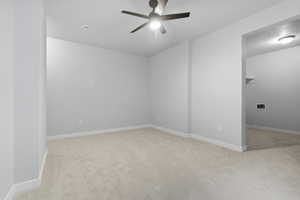 Unfurnished room featuring a ceiling fan