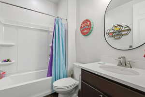 Full bathroom featuring vanity and shower / bath combo