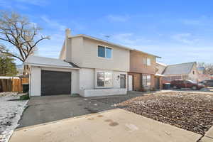Twin house featuring an attached garage