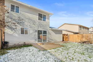 Rear view of house featuring a patio