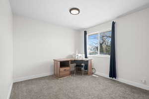 Office area featuring carpet flooring