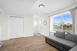 Living area featuring LVP floors and a textured ceiling