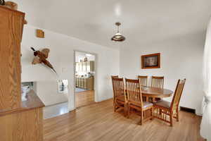 Dining area featuring light wood-style flooring