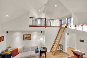 Family room featuring high vaulted ceiling and recessed lighting