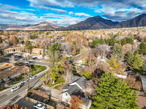 View of property location featuring a mountain backdrop and nearby suburban area