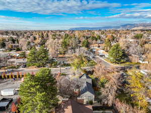 Aerial perspective of suburban area featuring a mountainous background