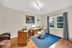 Bedroom featuring light wood-style flooring and baseboards
