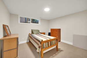 Bedroom with light carpet