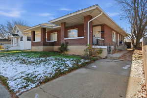 View of front of home featuring brick siding