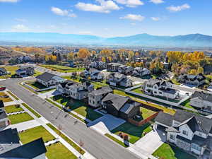 Aerial view of residential area featuring a mountain backdrop