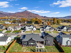 Aerial perspective of suburban area featuring a mountainous background