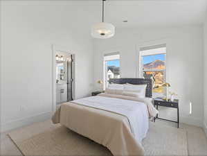 Bedroom with baseboards and ensuite bathroom
