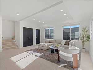 Living room featuring recessed lighting, stairway, and light carpet