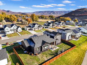 Aerial perspective of suburban area with a mountain backdrop