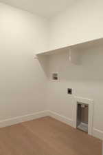 Washroom with light wood-style flooring, electric dryer hookup, and washer hookup