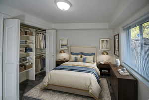 Carpeted bedroom featuring a closet