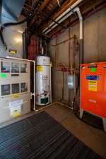 Utilities featuring water heater, a heating unit, and heating unit