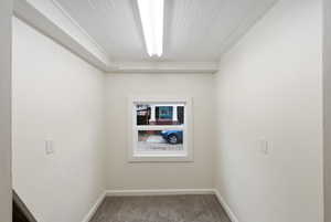 Carpeted spare room with baseboards