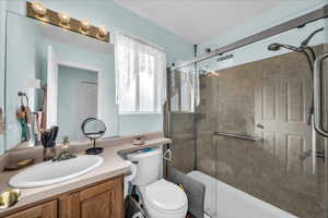 Full bath featuring vanity, plenty of natural light, and a stall shower