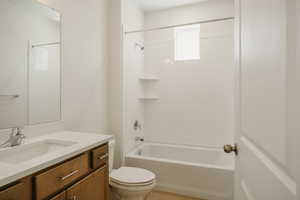 Full bath featuring vanity and shower / washtub combination
