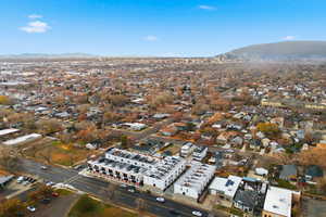 Aerial overview of property's location featuring a mountain backdrop