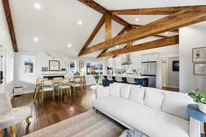 Living area with dark wood-style floors and recessed lighting