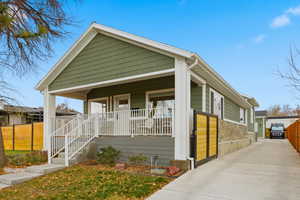 Bungalow-style home with a porch and driveway
