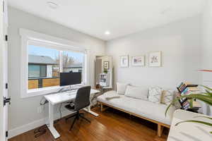 Office area featuring hardwood / wood-style flooring and baseboards