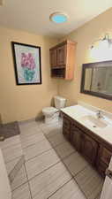 Full bath featuring vanity and a shower