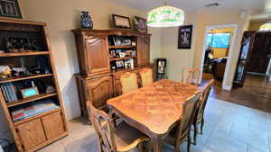 Dining area featuring light tile patterned floors